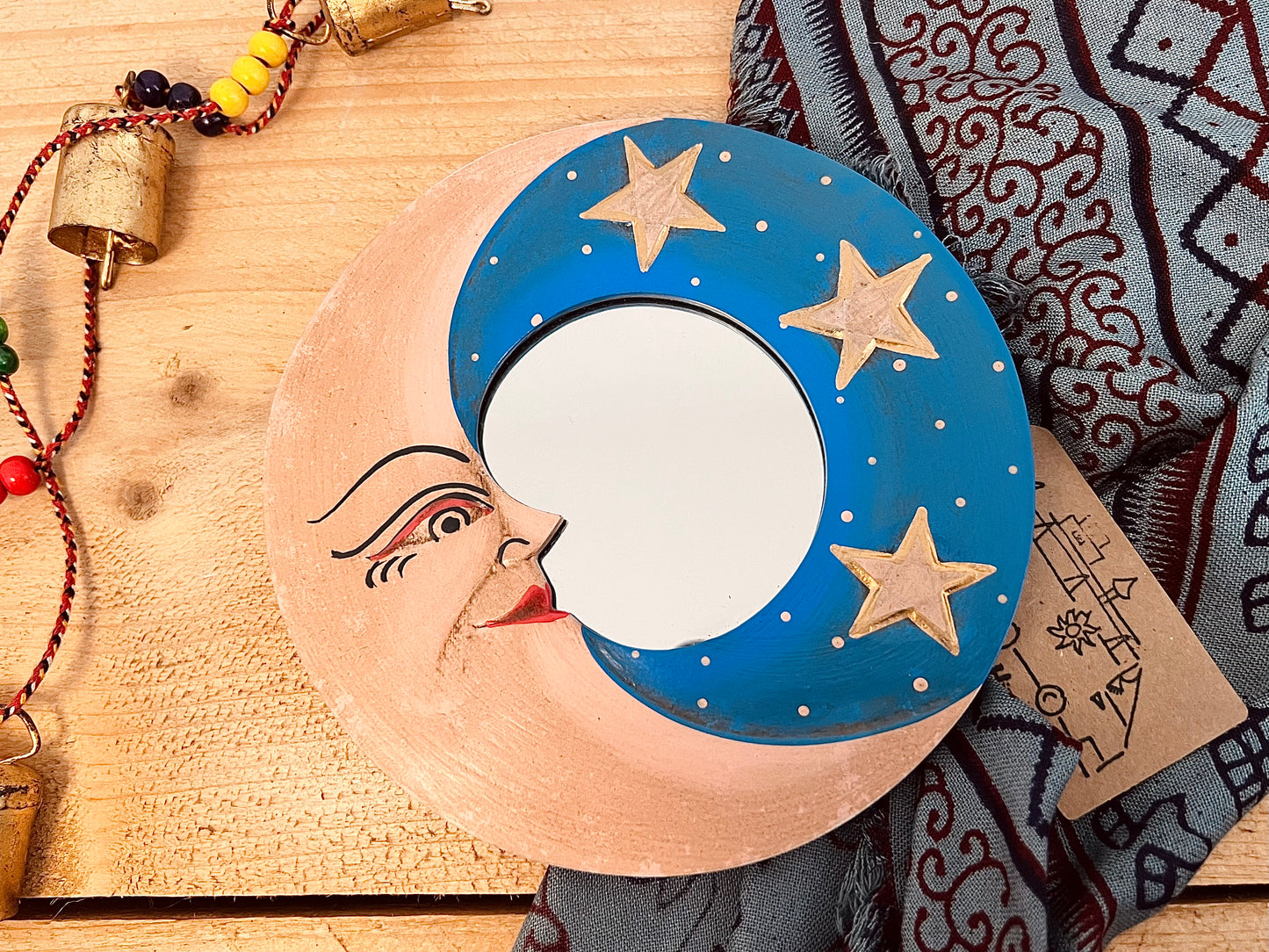 mini wooden wall hanging mirror with hippie boho moon & stars detailing in blue & yellow colour. Bohemian vintage style rustic finish small mini round wooden framed mirror. Handmade, Fair Trade, Ethical, Sustainable home decor.