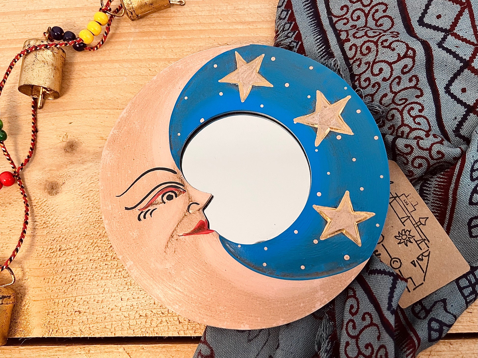 mini wooden wall hanging mirror with hippie boho moon & stars detailing in blue & yellow colour. Bohemian vintage style rustic finish small mini round wooden framed mirror. Handmade, Fair Trade, Ethical, Sustainable home decor.