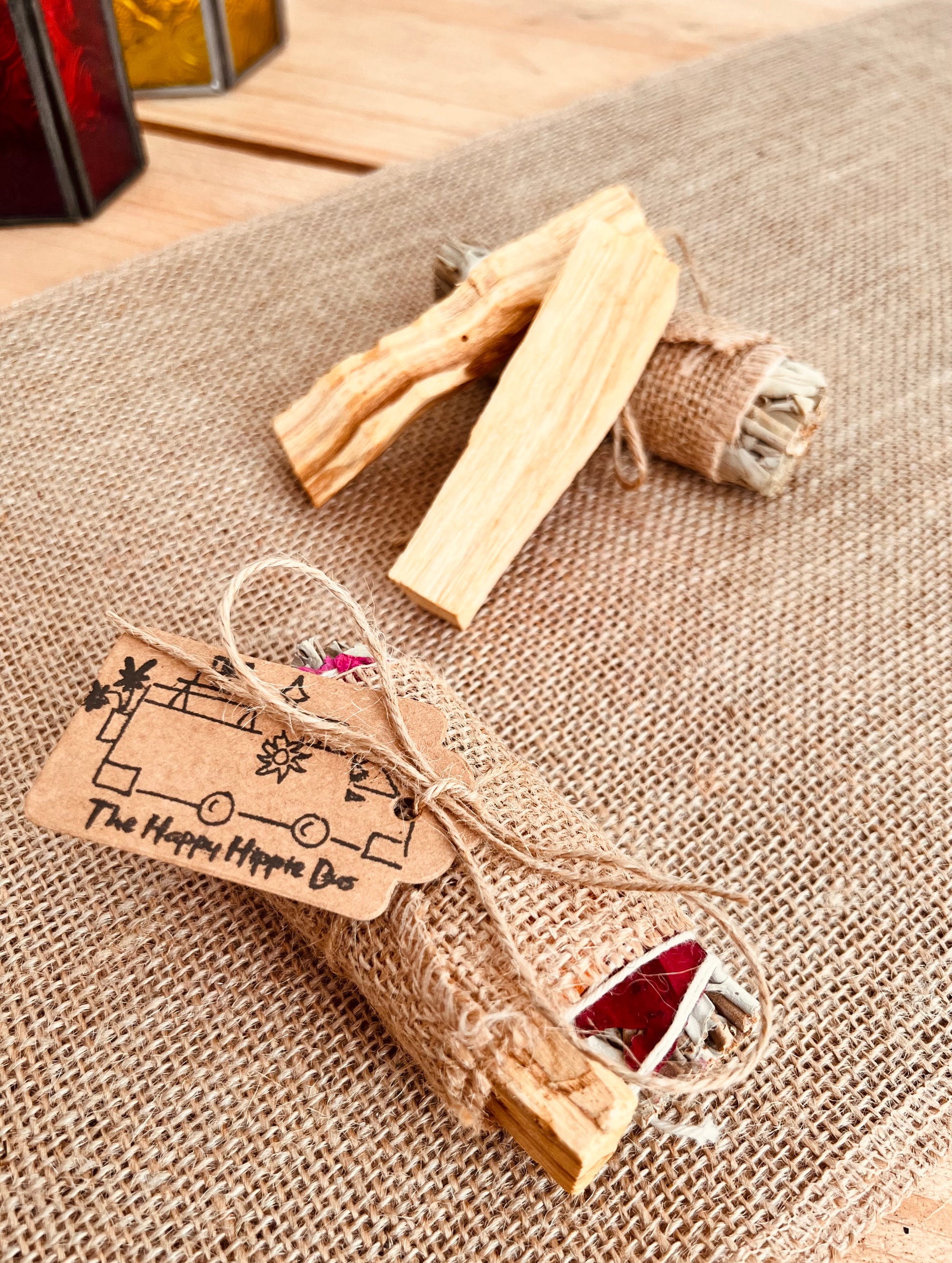 White sage smudge sticks with colourful rose petals wrapped with Palo Santo sticks, home fragrance, cleansing ritual incense 