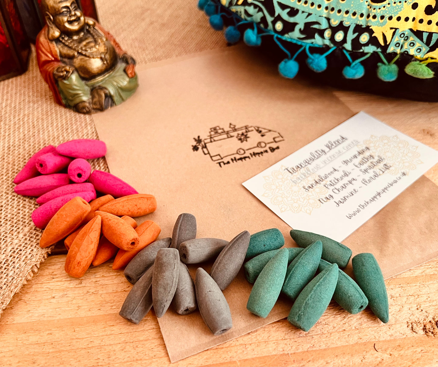 Tranquility Blend incense cone burning on backflow burner with cascading smoke effect