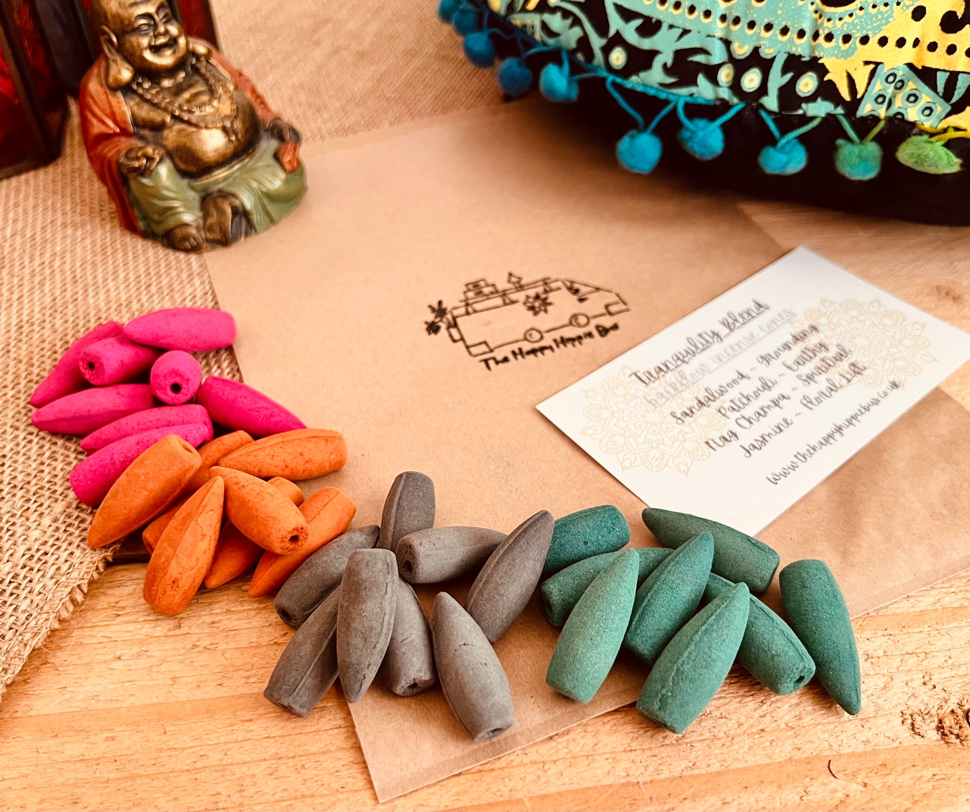 Tranquility Blend incense cone burning on backflow burner with cascading smoke effect