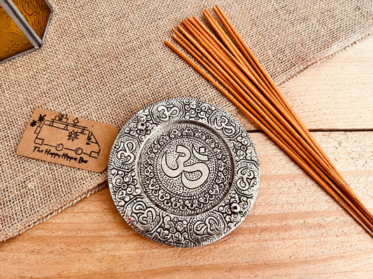 Metal plate incense stick holder burner derailed with intricate yoga Om Symbol design pattern in silver finish, handmade fair trade and ethically sourced, perfect for burning two incense sticks 