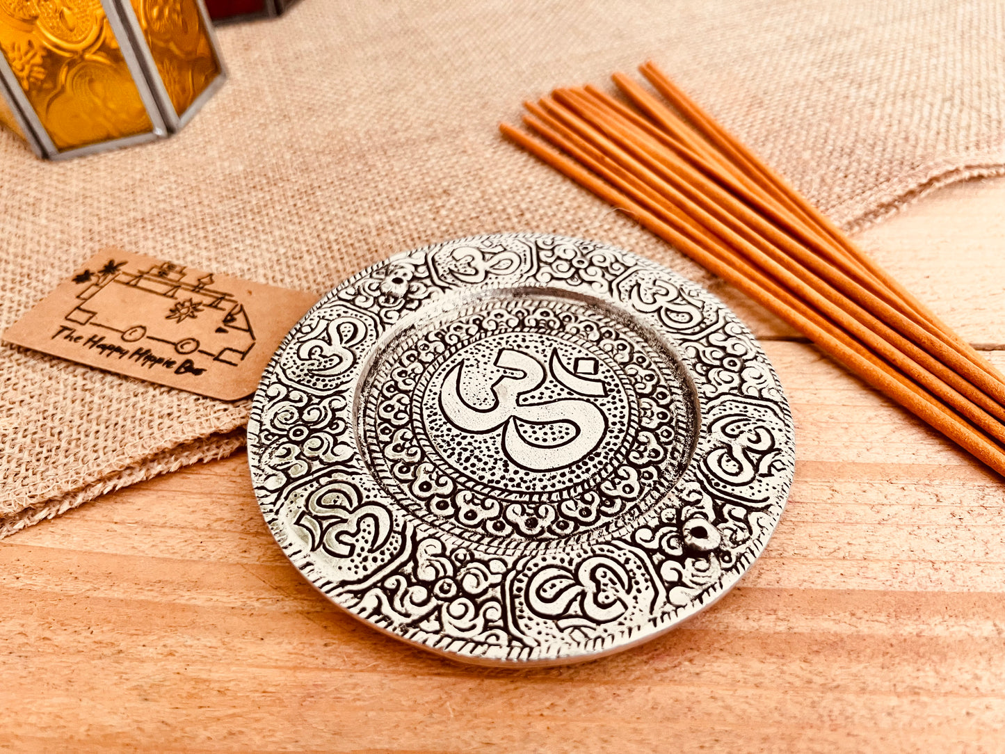 Metal plate incense stick holder burner derailed with intricate yoga Om Symbol design pattern in silver finish, handmade fair trade and ethically sourced, perfect for burning two incense sticks 