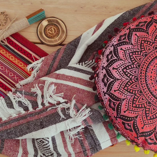 Artisan handcrafted meditation gift set in earthy red tones with yoga cushion, cotton throw, incense and holder – sustainable mindful living decor