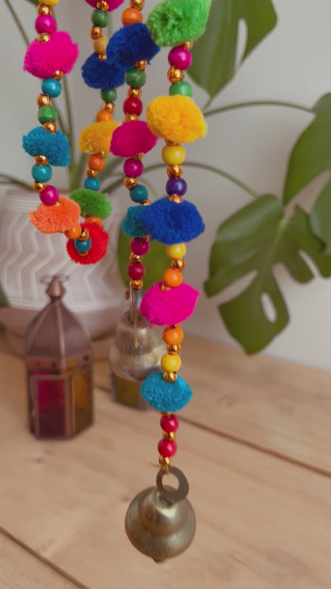 Long string of colourful handmade pom pom bells, hanging string of bells & beads, home living boho hippie decor bells, handmade, fair trade, ethically sourced